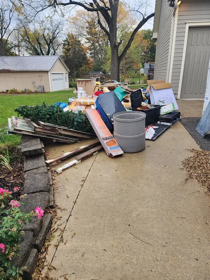 Dumpster being loaded with debris for Demolition Dumpster Rental in Grantville